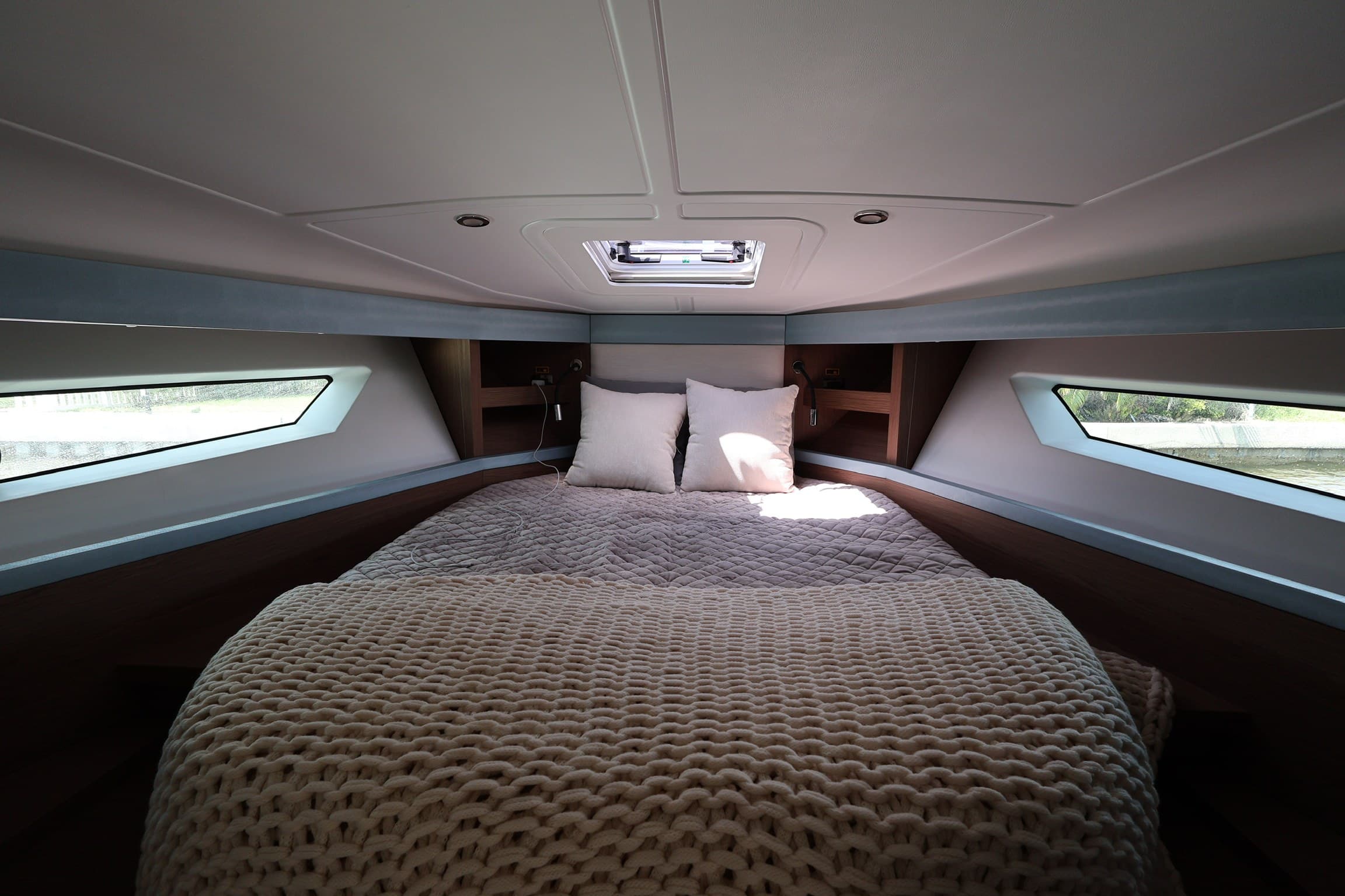 The forward cabin double berth under an overhead hatch
